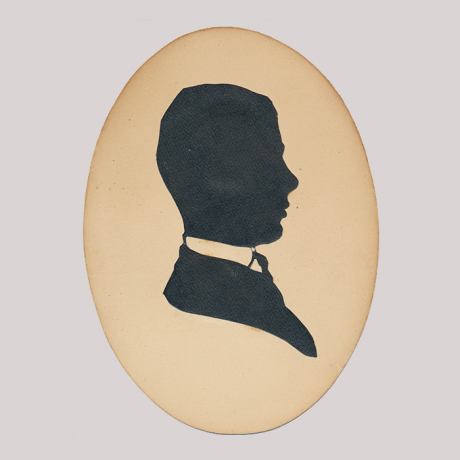 
        Front of silhouette, with man looking right, in suit.